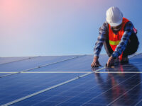 Electrical, instrument technician use wrench for fix and maintenance electrical system at solar panel field What Kind of Fasteners are Required for Solar Panel Installation?