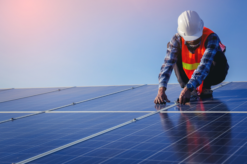 Electrical, instrument technician use wrench for fix and maintenance electrical system at solar panel field